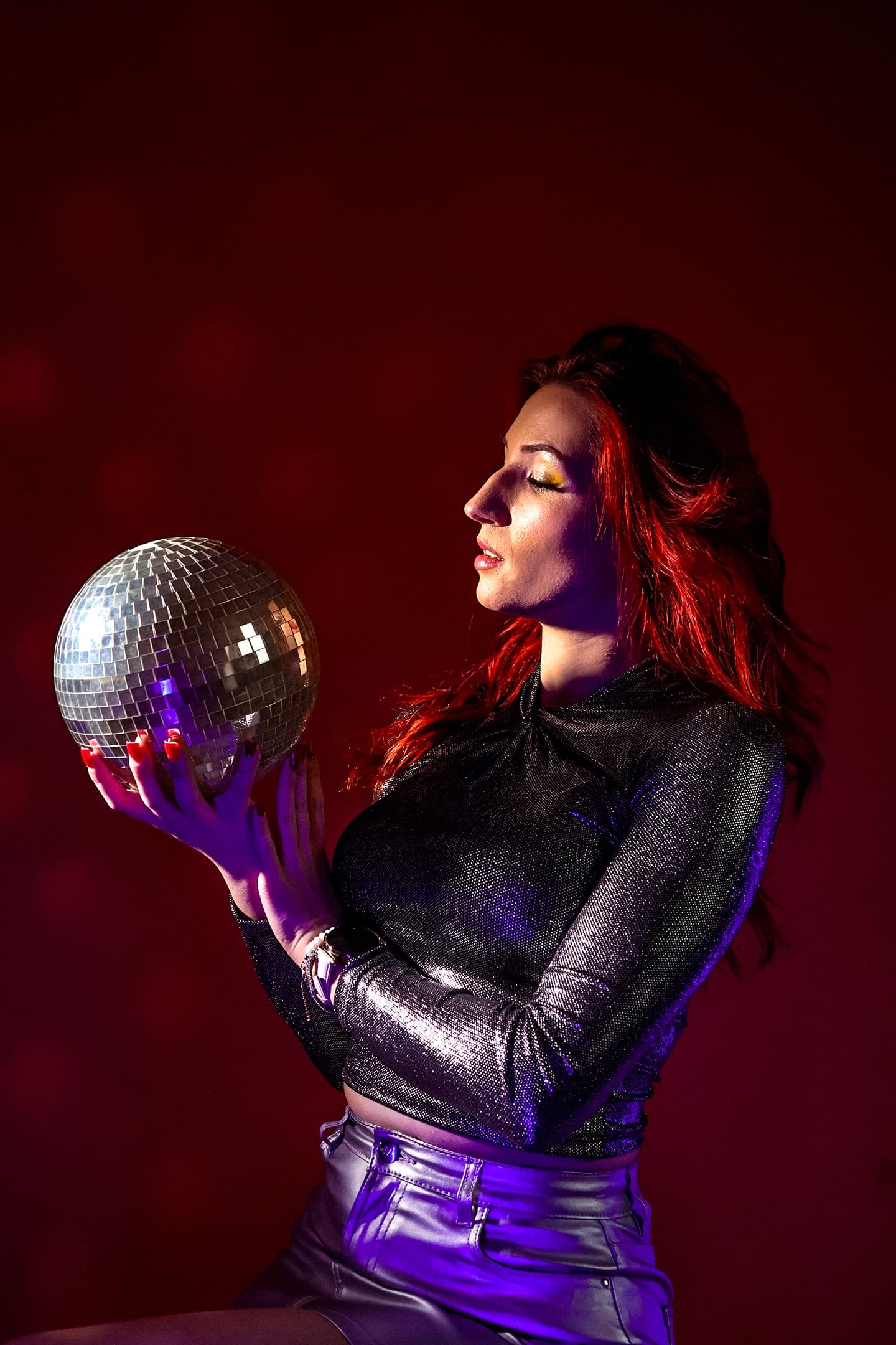 REAVI holding a disco ball
